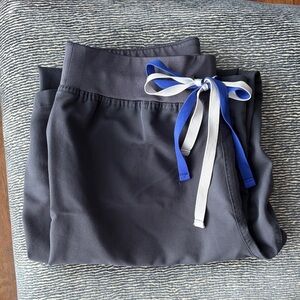 Gray Figs Livingston high waisted scrub pants with a double colored tie